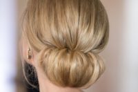 05 a low chignon bun with a volume on top for a very elegant and sophisticated look