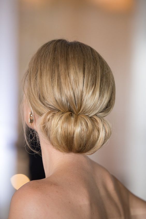 a low chignon bun with a volume on top for a very elegant and sophisticated look
