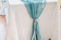 05 a watercolor blue table runner with a ribbon for a something blue touch or a romantic watercolor touch