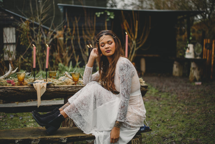 Rocking comfy black booties is also a great idea for a boho woodland bride