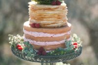 06 a naked partly pancake wedding cake with raspberries decorated with greenery is a catchy idea