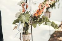 a table runner with blooms and greenery