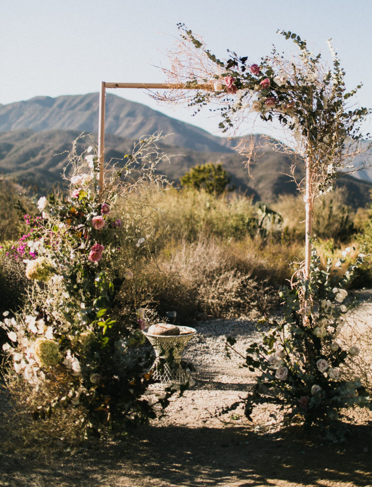 The wedding arch was of tubing and decorated with lush florals and greenery