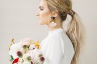 07 a usual messy ponytail with a texture, a volume on top is ideal for a modern or minimalist bride