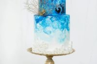 07 a very bold watercolor ombre blue wedding cake with a croal and textures