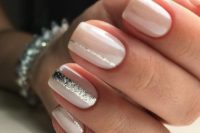 07 creamy nails with silver glitter stripes on some of them for a modern romantic look
