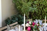 07 lush table decor with graphite grey plates, bold blooms, crystal glasses and candles plus greenery for a fall garden shower