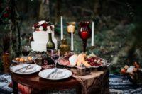 08 An adorable picnic setting was done with candle holders, silver flatware and candle lanterns
