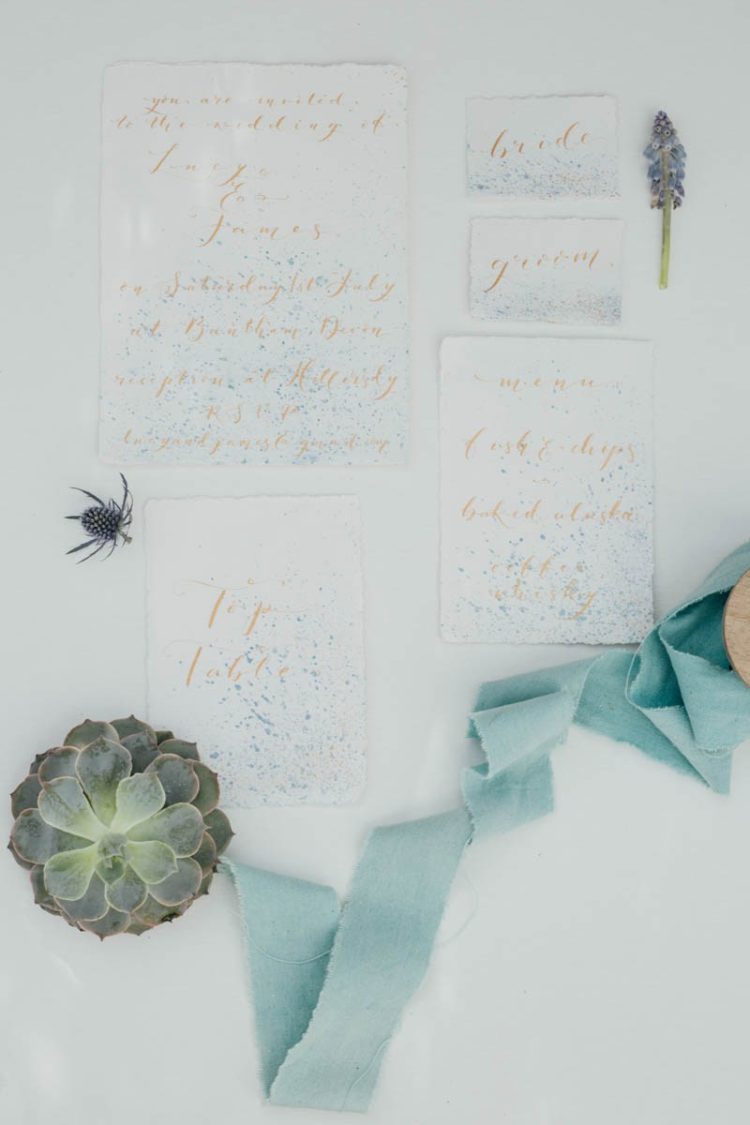The wedding stationery was done with a seaside feel, it was splattered with blue dots and with copper calligraphy