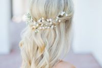 08 a half updo with a halo with baby’s breath and waves down for a romantic look