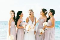 08 blush maxi dresses with various necklines look very tender and stand out on a white beach