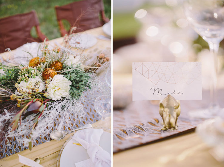 The centerpiece was done with various grasses, orange blooms and feathers
