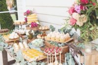 09 a garden shower sweets table with lush florals and greenery, much eucalyptus makes the table feel fresh