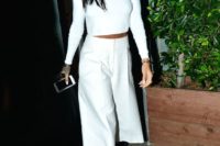 09 a white crop top with long sleeves, white cropped culottes, black lace up shoes for a minimalist bride