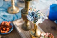 10 Beautiful blue and white blooms and succulents were used for table decor to give it a coastal feel