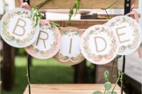 10 a letter banner with fresh greenery to decorate the bride’s chair is a cute and easy to make idea