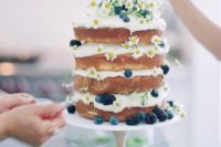 10 a naked summer cake with daisies, blueberries and blackberries for a boho or country summer wedding