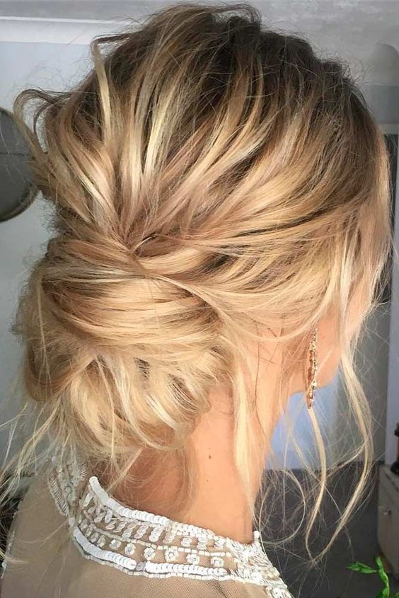 a very messy low bun, locks down and a messy volume on top will fit both long and medium hair