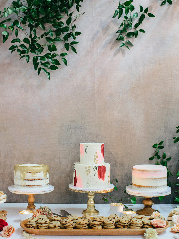 There were three wedding cakes, two nakes ones and a buttercream brushstroke one