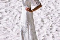 11 a boho lace sheath wedding dress with an off the shoulder neckline and spaghetti straps