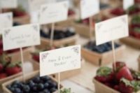 11 assorted berries in boxes holding escort cards can be delicious favors, too, very functional