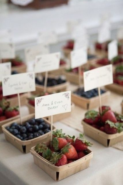 assorted berries in boxes holding escort cards can be delicious favors, too, very functional