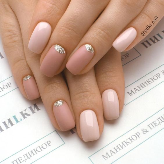 glossy and matte nude and dusty pink nails with silve glitter half moons for a super trendy look