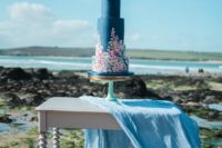 12 The wedding cake was a navy one, with handpainted florals, a succulent on top and blue fabric