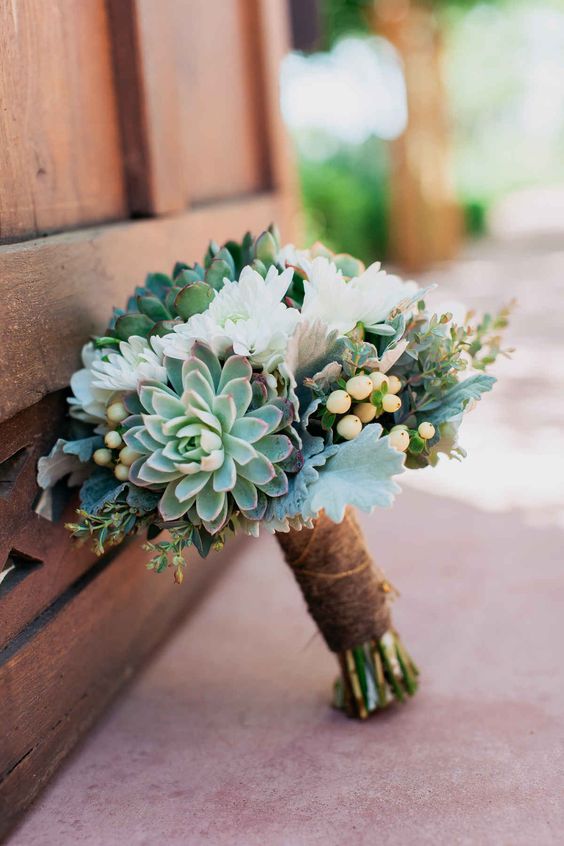 a succulent and white bloom wedding bouquet with a rustic wrap for a chic rustic look