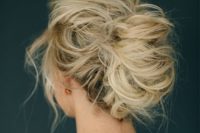 12 a very messy updo with locks down and much volume for a very casual and boho look