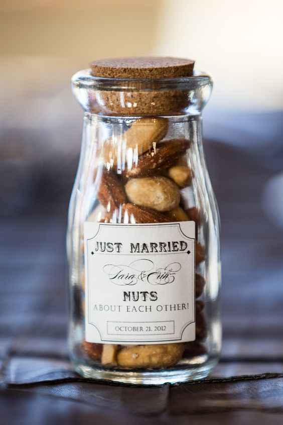 assorted nuts in a glass jar is always a great idea for most of weddings, from rustic to woodland ones
