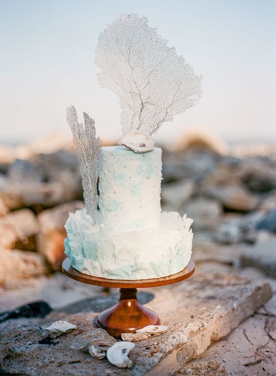  a gorgeous textural watercolor aqua wedding cake with a sugar shell, pearls and corals