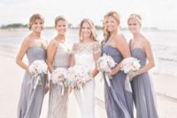 13 grey strapless and one shoulder maxi dresses for the bridesmaids and an embellished dress for the maid of honor