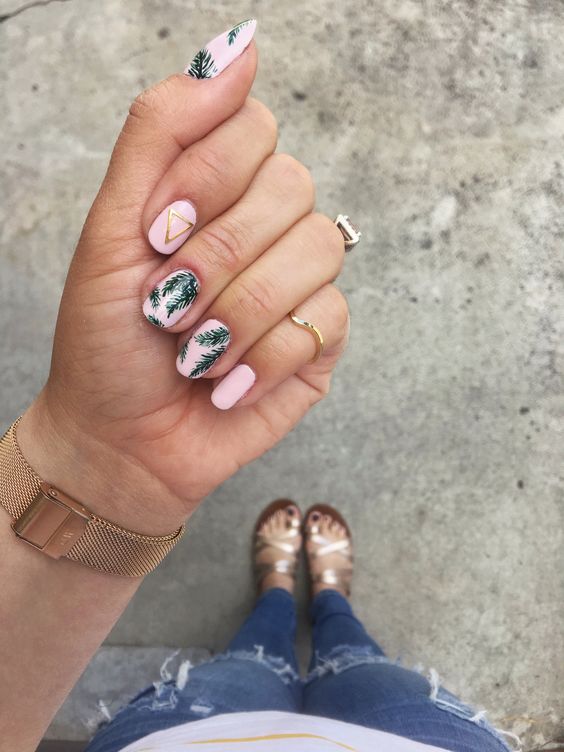 pink nails with tropical leaf prints and metallic geometric touches for a tropical or beanch bride