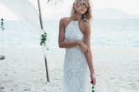 16 a boho lace halter neckline fitting wedding dress with fringe for a beach wedding