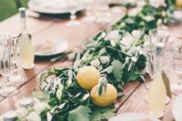 16 a greenery table runner with some lemons for a bold and fresh summer feel, add Limoncello as gifts