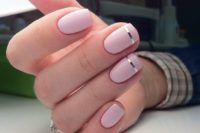 16 light pink nails with thin silver stripes is a chic modenr nail art suitable for a modern or minimalist bride