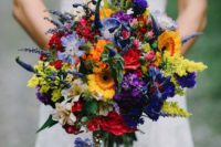 17 a wildflower wedding bouquet with red, yellow, orange, purple, lavender and greenery for a bold look