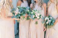 17 blush halter neckline maxi dresses with gold touches and light pleating for a glam touch