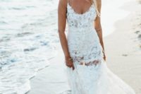 18 a lace spaghetti strap wedding dress with a scoop neckline and an illusion skirt