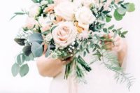 19 a beautiful blush and cream rose wedding bouquet with textural greenery for a neutral-colored wedding