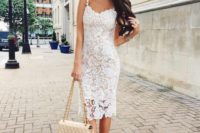 19 a lace sheath midi dress with spaghetti straps, nude shoes and statement earrings and a ring