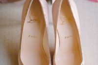19 chic blush pointed toe heels with a touch of glitter by Christian Louboutin are a timelessly elegant choice