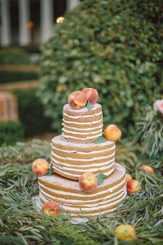 naked peach wedding cake topped fresh peaches for a southern wedding