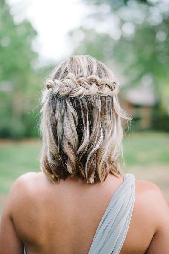 wavy hair down with a braided halo is a nice idea for those who have long bob