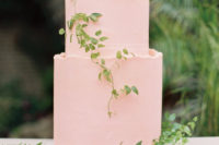 21 a light pink buttercream cake decorated with delicate greenery garlands on top and around is a cute idea for a dessert table