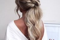 23 a low twisted textured ponytail with waves, locks down and a hair vine looks very romantic