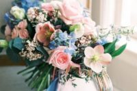 23 a very sweet wedding bouquet in light blue and pink with matching ribbons hanging down