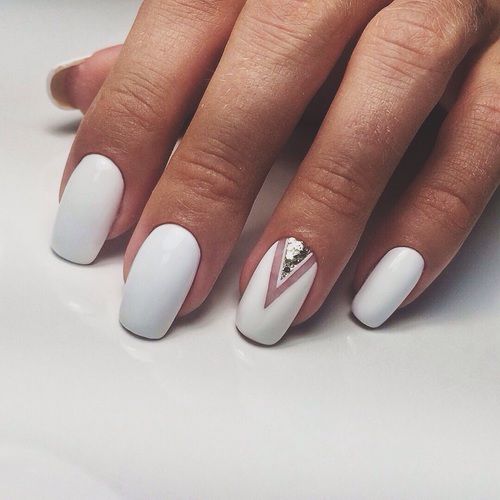 matte white nails and a single accent nail with silver sequins for a super elegant yet minimalist look