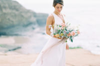 25 a modern A-line wedding dress with thick straps, a plunging neckline for a modern beach bride